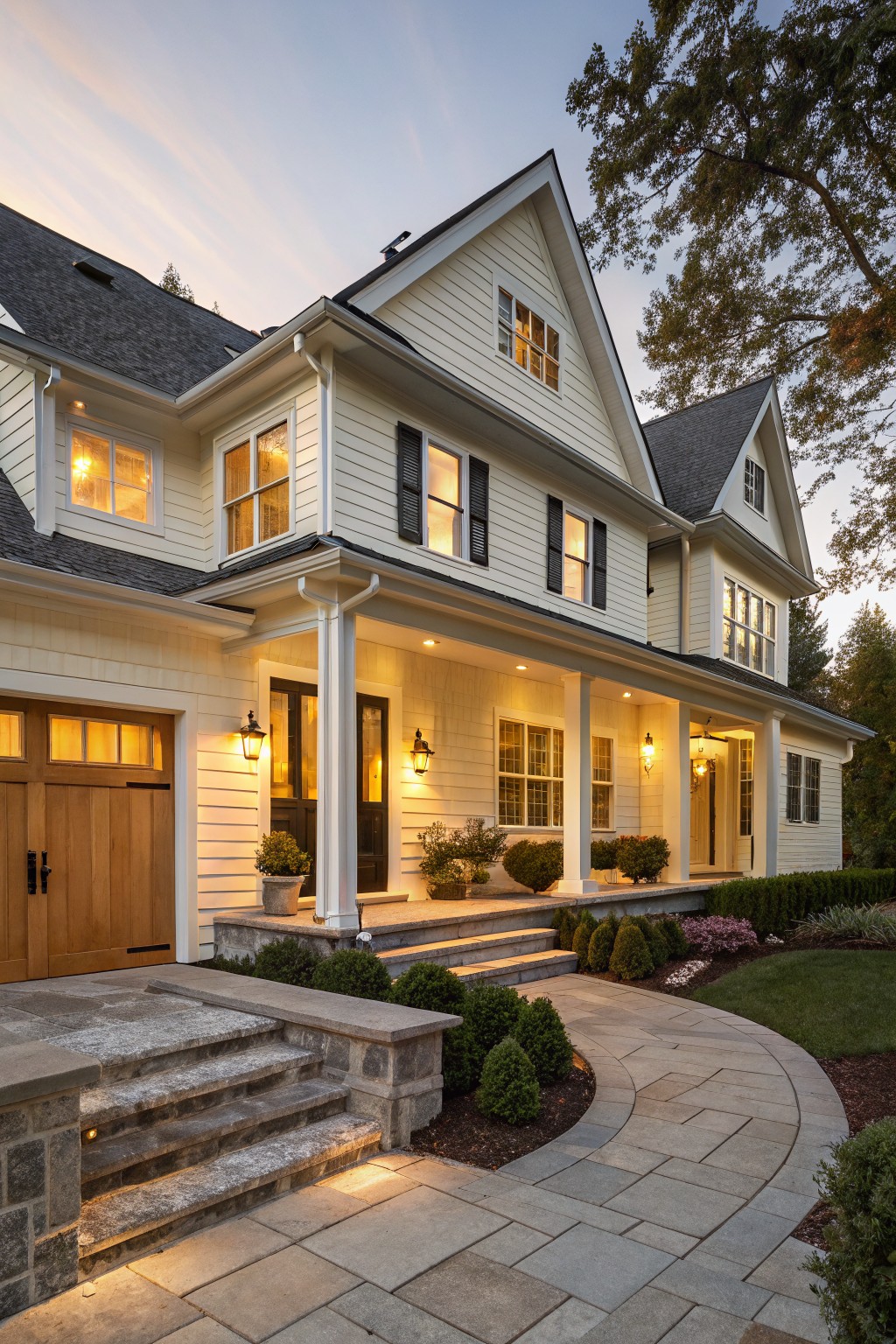 A house with warm white siding and stone steps.