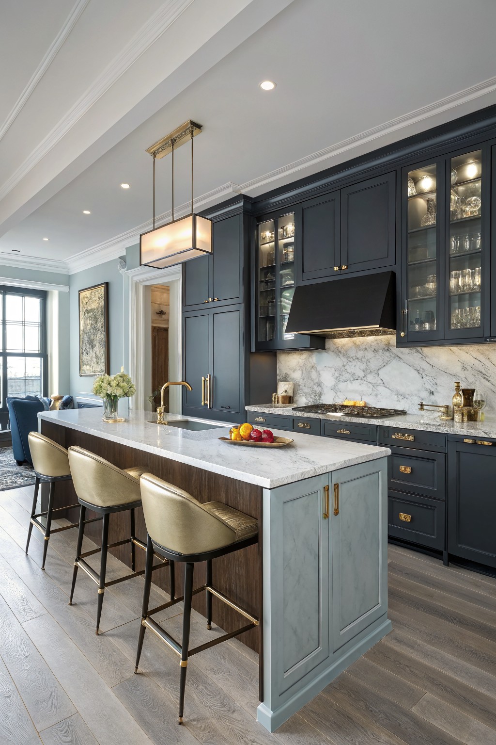 The kitchen island base is painted a soft blue gray next to dark cabinets.