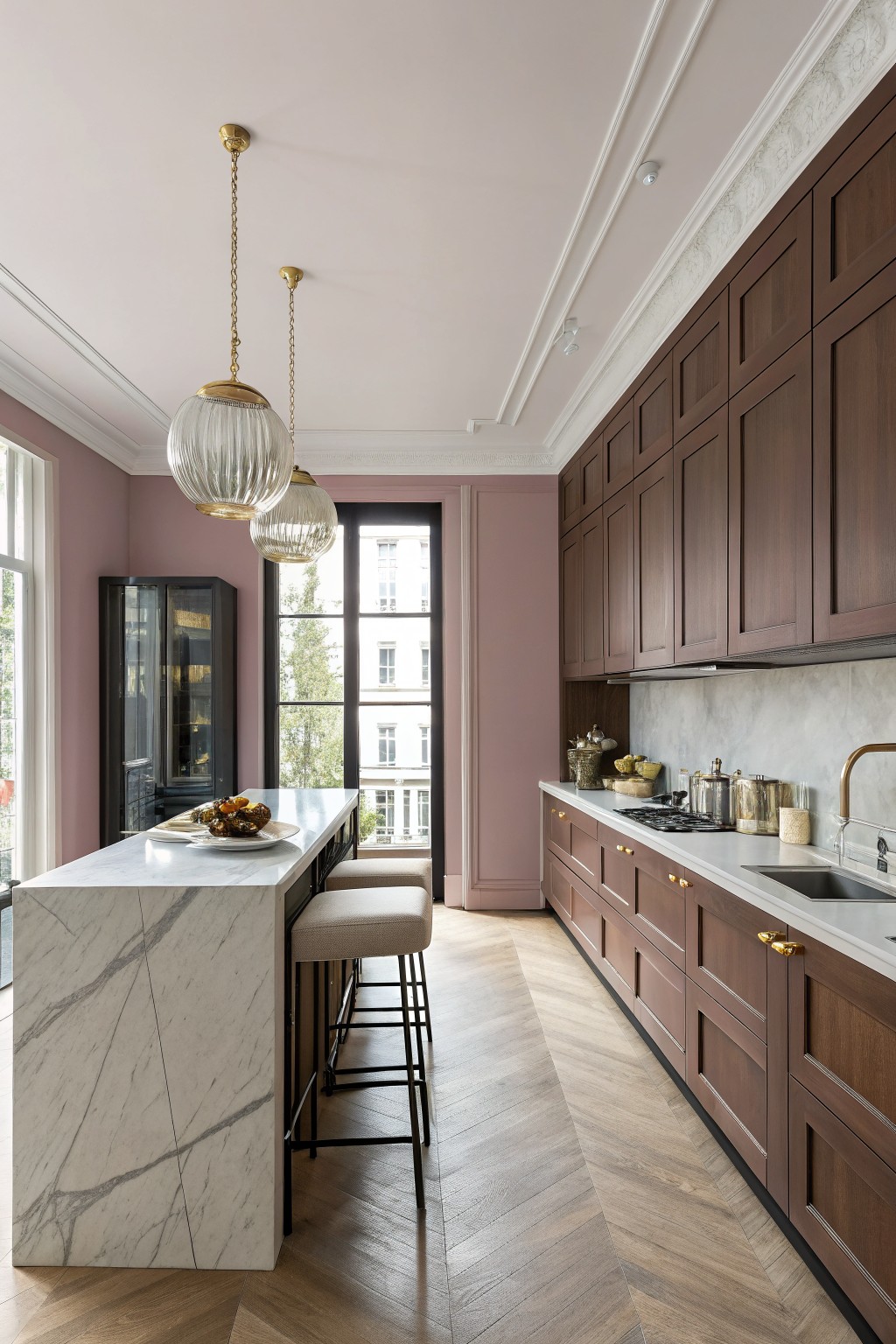 Kitchen walls painted a soft dusty rose next to dark wood cabinets.